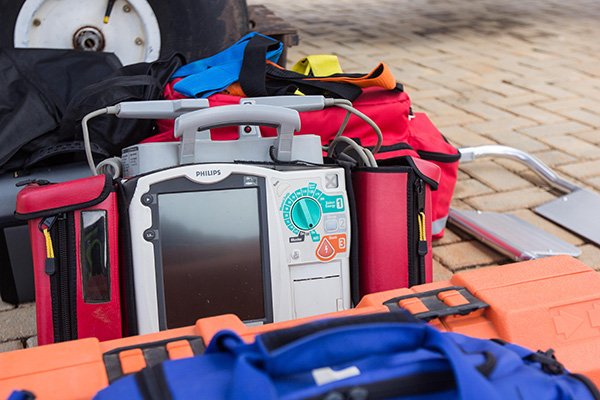 Female Paramedics Handling Patient on Stretcher Female Paramedics Handling Patient on Stretcher